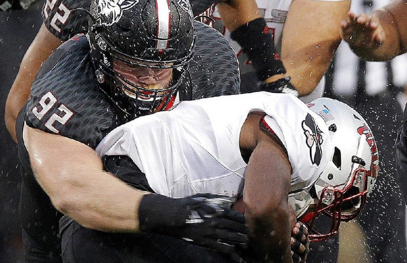 Arkansas State junior defensive lineman Forrest Merrill (92) makes a tackle during the Red Wolves’ victory over UNLV on Saturday at Centennial Bank Stadium in Jonesboro.
