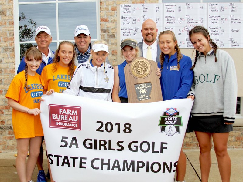 The Sentinel-Record/Jami Smith STATE CHAMPIONS: Members of Lakeside's girls' golf team celebrate Wednesday at the Hot Springs Country Club after winning the 2018 Class 5A girls' state golf tournament.