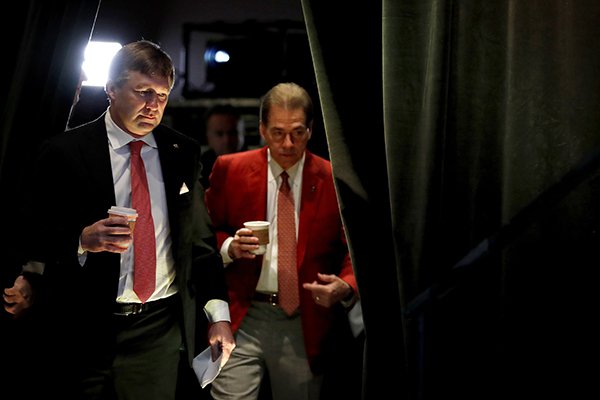 Georgia head coach Kirby Smart, left, and Alabama head coach Nick Saban arrive for a press conference ahead of the NCAA college football national championship in Atlanta, Sunday, Jan. 7, 2018. (AP Photo/David Goldman)

