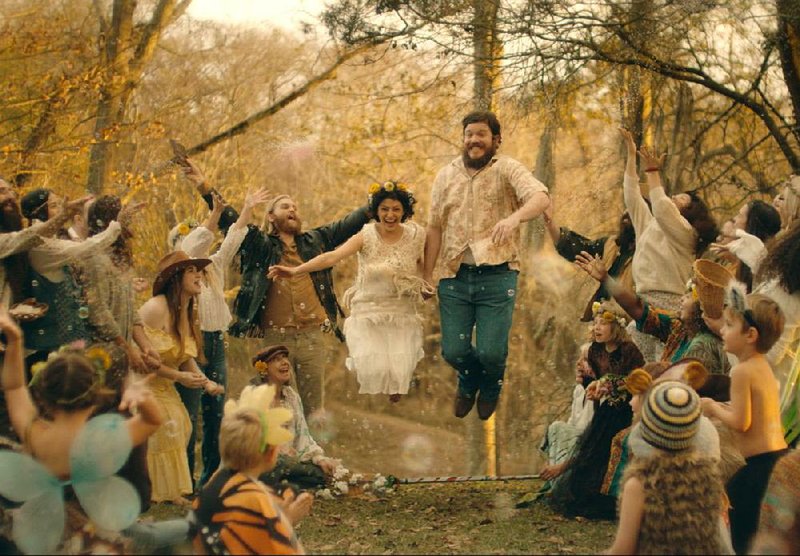Blaze Foley (Ben Dickey) and Sybil Rosen (Alia Shawkat) jump the broom in this scene from Ethan Hawke’s Blaze, a story about what you have to give up to follow your dream.
