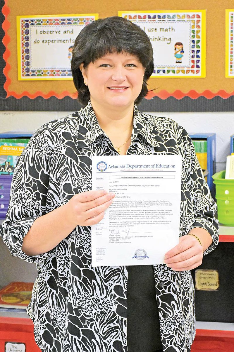 Tonya Hogue of Conway, a fourth-grade science teacher at Mayflower Elementary School, holds the letter she received from the Arkansas Department of Education telling her she is a finalist for the Presidential Award for Excellence in Mathematics and Science Teaching. “I was so excited,” she said. Hogue will find out in June if she is one of two statewide winners.