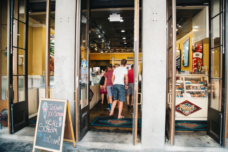 Consumers wait in line inside an ice cream store in the French Quarter district of New Orleans on June 13, 2018. 