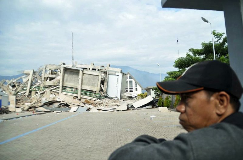 A structure lies in shambles Saturday in Palu, Central Sulawesi, Indonesia, after a strong earthquake and tsunami struck the island. Similar scenes of destruction could be found all across the city of Palu. 