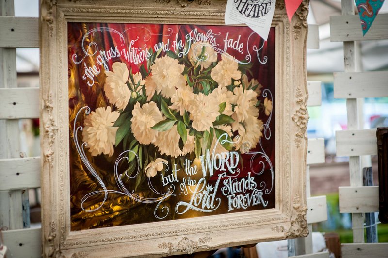 NWA Democrat-Gazette/LARA JO HIGHTOWER Okies and Indies owner Lynnette Overstreet uses her talent for hand-lettering to upcycle vintage treasures with meaningful quotes.