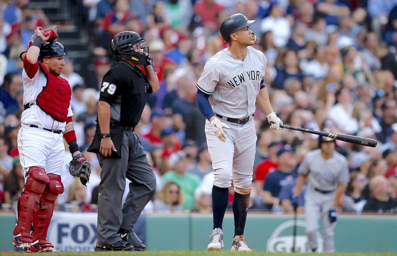 Boston Red Sox's Brock Holt watches his two-run home run during the ninth  inning of a baseball game against the New York Yankees in Boston, Saturday,  Sept. 29, 2018. (AP Photo/Michael Dwyer