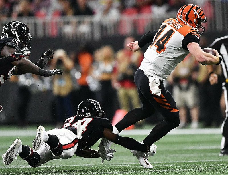 Cincinnati quarterback Andy Dalton (14) completed 29 of 41 passes for 337 yards and 3 touchdowns including the game-winner to A.J. Green with 13 seconds left to give the Bengals a 37-36 victory over the Atlanta Falcons on Sunday.