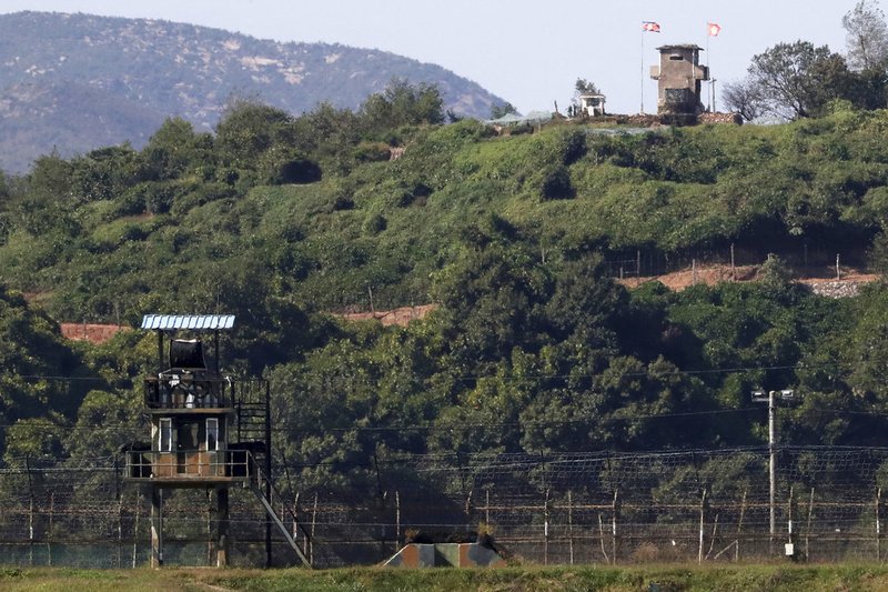 In this Sunday, Sept. 30, 2018, photo, military guard posts of North Korea, right top, and South Korea, left bottom, are seen in Paju, at the border with North Korea, South Korea.