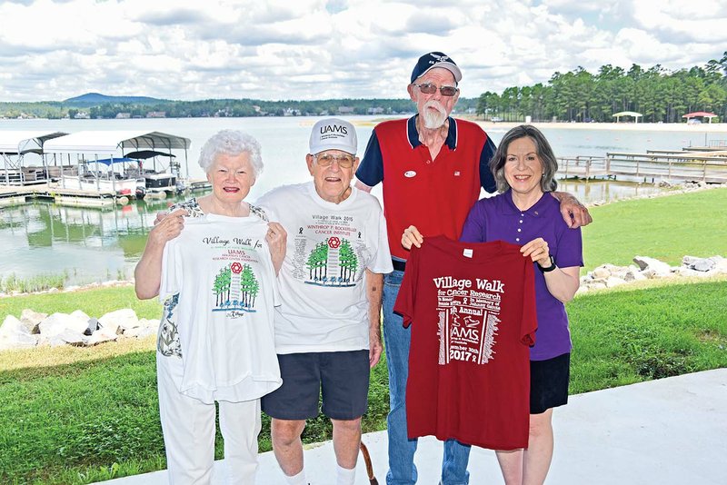 Getting ready for the 17th annual Village Walk for Cancer Research are, front row, from left, Claire MacNeill, Ken MacNeill and Melanie Pederson, showing various T-shirts from the event, and Dick Antoine, back, who will act as master of ceremonies for this year’s fundraiser. The 5-mile walk will begin at the Balboa Pavilion on Lake Balboa in Hot Springs Village.