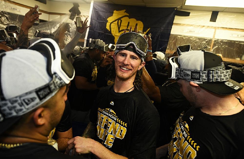 Brewers celebrating inside the visitor's clubhouse at Wrigley Field