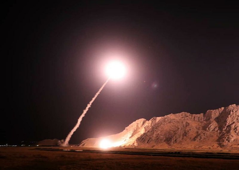 In this photo released on Monday, by the Iranian Revolutionary Guard, a missile is fired from the city of Kermanshah in western Iran targeting the Islamic State group in Syria.