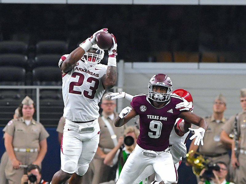 NWA Democrat-Gazette/J.T. Wampler SEC FOOTBALL: Senior Arkansas linebacker Dre Greenlaw (23) intercepts a pass intended for Texas A&M's Hezekiah Jones (9) Saturday during the Razorbacks' 24-17 loss to the Aggies at the Dallas Cowboys' AT&T Stadium in Arlington, Texas.