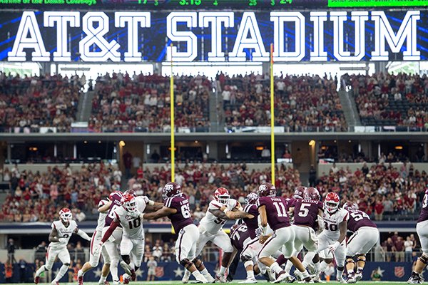 Texas A&M quarterback Kellen Mond (11) drops back to pass against Arkansas during the fourth quarter of an NCAA college football game Saturday, Sept. 29, 2018, in Arlington, Texas. (AP Photo/Jeffrey McWhorter)