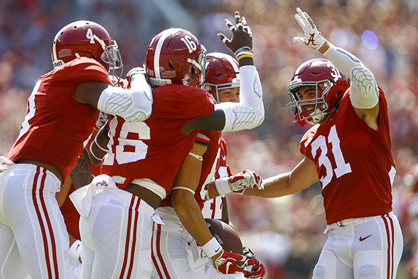 Alabama wide receiver Derek Kief (81) celebrates with teammates after blocking a punt against Louisiana-Lafayette during the first half of an NCAA college football game, Saturday, Sept. 29, 2018, in Tuscaloosa, Ala. (AP Photo/Butch Dill)

