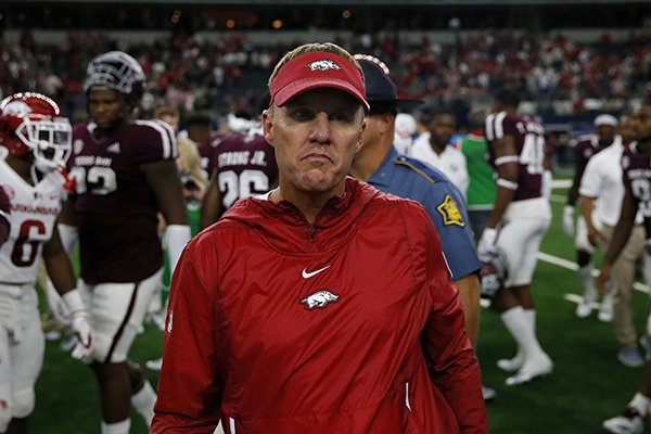 Arkansas Razorbacks head coach Chad Morris walks off the field after an NCAA college football game against the Texas A&M Aggies, Saturday, Sept. 29, 2018, in Arlington, Texas. The Razorbacks lost to the Aggies 24-17. (AP Photo/Roger Steinman)

