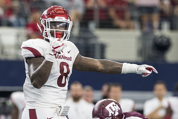 Arkansas linebacker De'Jon Harris calls out a play at the line of scrimmage during a game against Texas A&M on Saturday, Sept. 29, 2018, in Arlington, Texas.
