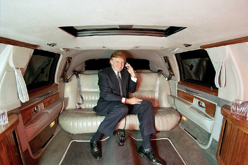 Donald Trump poses in a limousine in New York in this Dec. 9, 1999, photo. According to an investigation by The New York Times, Trump received the equivalent today of at least $413 million from his father’s real estate empire in systematic payments involving dubious tax schemes, starting when he was a toddler and continuing to today. 
