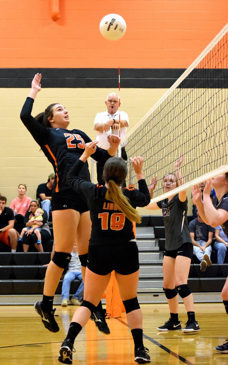 Westside Eagle Observer/MIKE ECKELS Olivia Perry (Lions 25) gets ready to spike the ball deep into Lady Eagle territory during the volleyball match between Gravette and Huntsville Sept. 25 in Gravette.