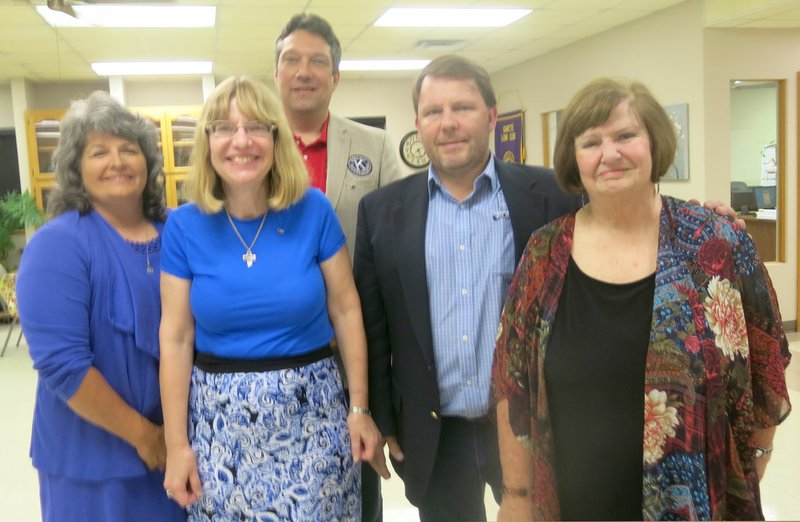 Westside Eagle Observer/SUSAN HOLLAND David Bailey, lieutenant governor of MOARK District 19, Kiwanis (center) poses with new 2018-2019 officers of the Gravette Kiwanis Club after installing them at a dinner meeting Monday, Sept. 24. Pictured are Brenda Yates, secretary; Dr. Nancy Jones, president; Kurt Maddox; president-elect; and Lavon Stark, past president. Treasurer Malcolm Winters was unable to attend.