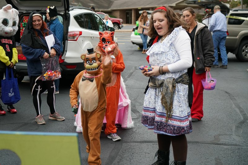 Photo submitted The Bella Vista Community Church's Trick or Treat event in 2017 gave these costumed visitors a safe place to enjoy the treat of Halloween. The 2018 A-MAZE-ING Trick or Treat will be held in the church parking lot from 5:30 to 7 p.m., Wednesday, Oct. 31.