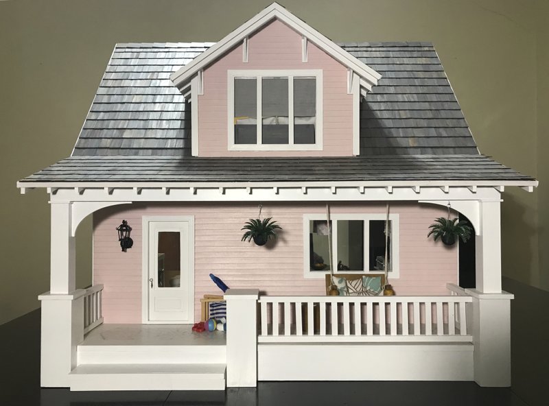 This 2018 photo provided by Amy Dorman shows the beach bungalow dollhouse she created in Des Moines, Iowa. The art of dollhouse design has gotten big thanks to social media. Fans can share pictures of their miniature creations and draw inspiration from each other. And today's creations tend to feature a modern look. (Amy Dorman via AP)

