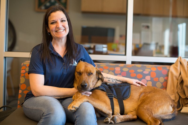 Arkansas Tech University student Shilo Schluterman and her service dog Javelin.