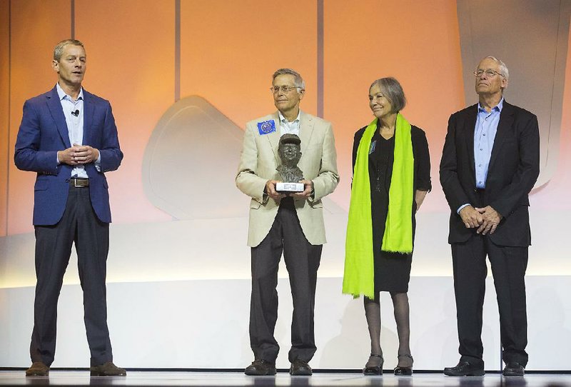 Jim Walton (left), Alice Walton and Rob Walton attend a Walmart shareholders event in Fayetteville in 2017. Jim Walton ranked 11th on this year’s Forbes 400 richest Americans list. Alice Walton and Rob Walton tied for 12th on the list.