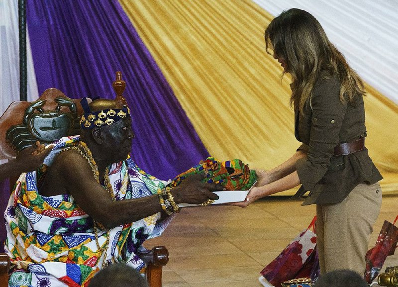 Osabarimba Kwesi Atta II, the chieftain of the Cape Coast Fante, presents gifts Wednesday to U.S. first lady Melania Trump during a cultural ceremony at the Emintsimadze Palace in Cape Coast, Ghana. 