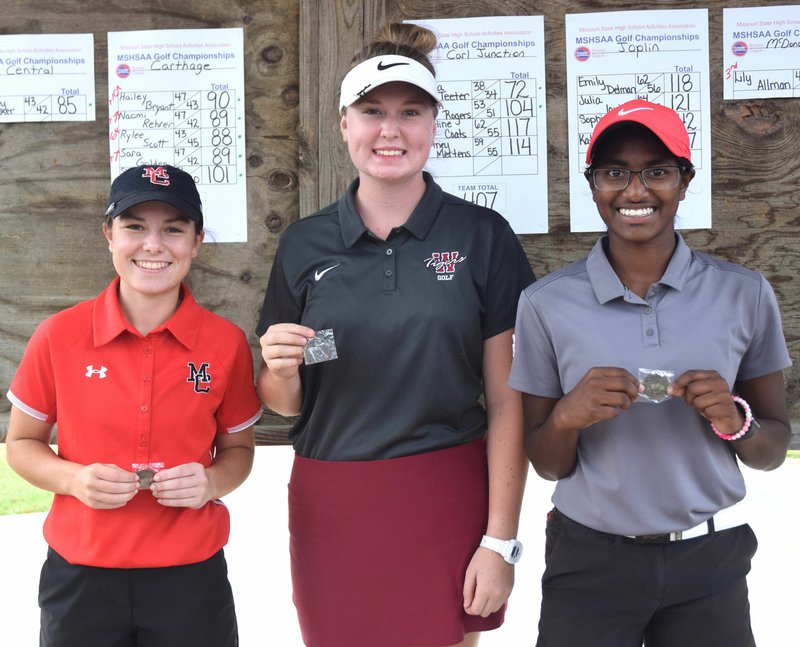 Rick Peck/Special to McDonald County Press McDonald County's Lily Allman (left) shot an 80 at the Missouri Class 2 District 6 Girls Golf Championships at the Carthage Golf Course on Monday to take third place and qualify for next week's sectional championships. Jenna Teeter (right) of Carl Junction won the district title with a 72, while Kayla Kimberly of Warrensburg was third with a 77.