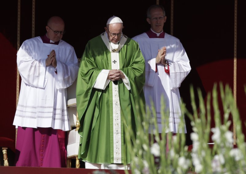 Pope Francis, center, celebrates a Mass for the opening of a synod, a meeting of bishops, in St. Peter's Square, at the Vatican, Wednesday, Oct. 3, 2018. The synod is bringing together 266 bishops from five continents for talks on helping young people feel called to the church at a time when church marriages and religious vocations are plummeting in much of the West. (AP Photo/Alessandra Tarantino)