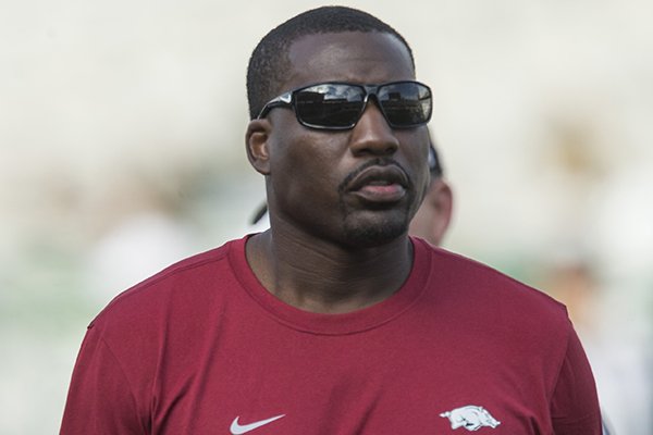 Arkansas defensive line coach John Scott Jr. watches warmups prior to a game against Colorado State on Saturday, Sept. 8, 2018, in Fort Collins, Colo.