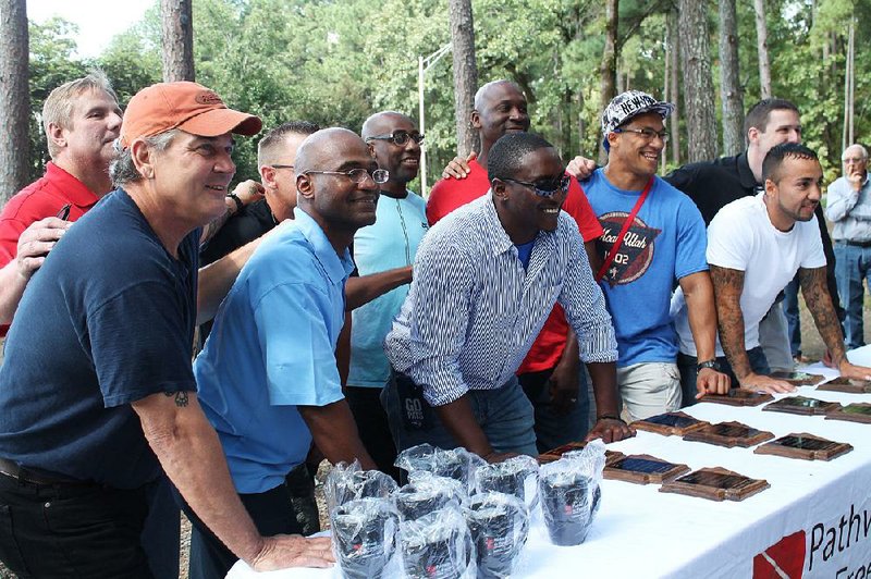 Scott McLean (front, second from left), executive director of the faith-based re-entry program Pathway to Freedom, and re-entry specialist Joe Bruton (far left) with some of the nonprofit’s 2018 graduating class: (from left) Paul Wallin, Torger Lewis, Dennis Warren, Cyle Cooney, Marion Butler, T.J. West, Indio Hendershot and Joshua Johnson. The men received plaques and certificates on Sept. 29 honoring them for their continued dedication to “the ongoing transformation process in your life” and a reminder of Jeremiah 29:11, “For you know the plans I have for you ... plans to give you a hope and a future.” 