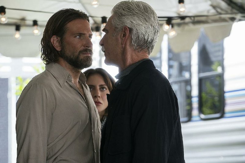 Jackson Maine (Bradley Cooper, left) is confronted by his brother, Bobby (Sam Elliott) while Ally (Lady Gaga) looks on in A Star Is Born.