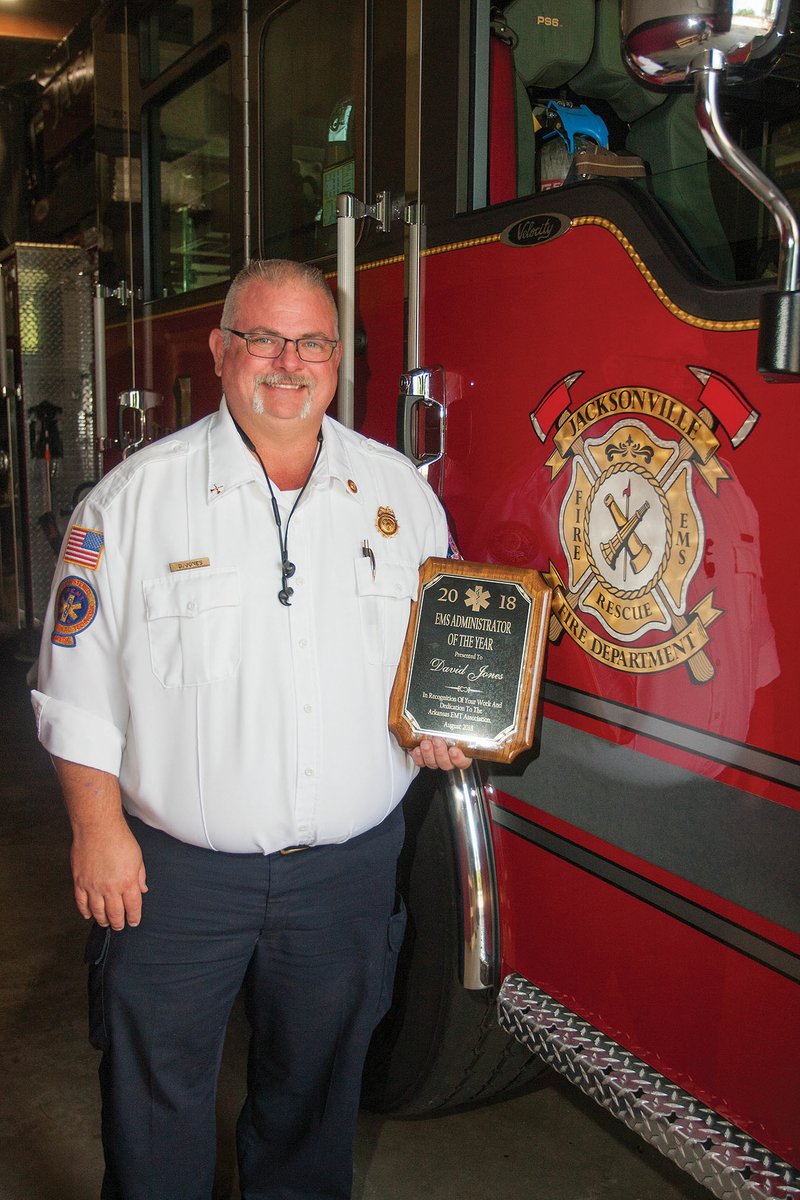 Capt. David Jones, the EMS operations supervisor for the Jacksonville Fire Department, holds the plaque he received for being honored as EMS Administrator of the Year by the Arkansas EMT Association during its banquet Aug. 4 in Hot Springs. Jones has worked for the Jacksonville Fire Department for 19 years.