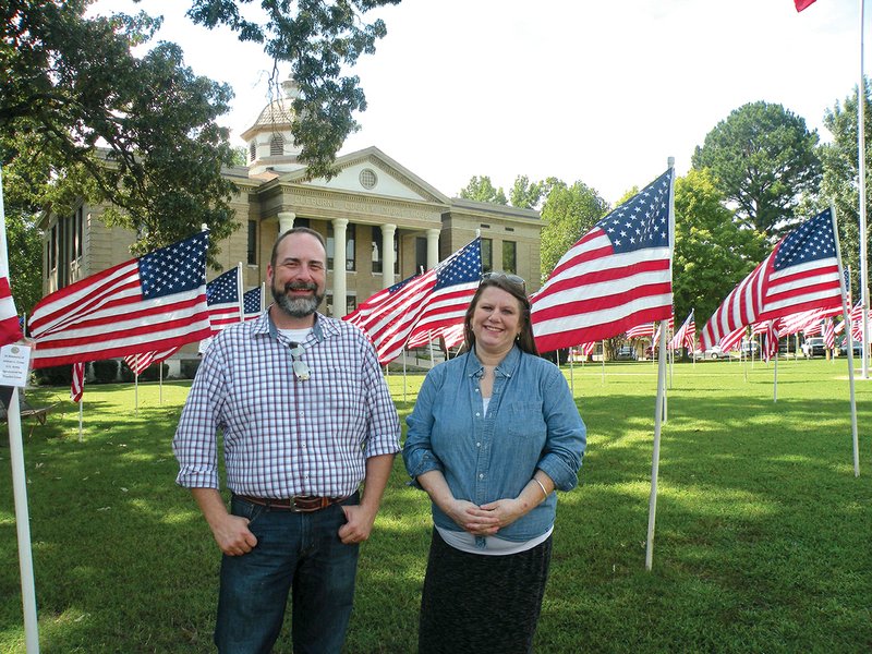 The Arkansas Historic Preservation Program will present a Walks Through History tour Saturday in Heber Springs. Zac Cothern, director of the Mary I. Wold Cleburne County Library, joins Amy Milliken, AHPP education coordinator, on the courthouse lawn, which is decorated with American flags through Nov. 11. Saturday’s tour will begin at the courthouse.