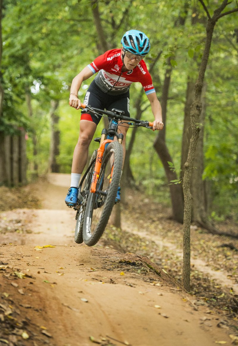 NWA Democrat-Gazette/BEN GOFF @NWABENGOFF Chloe Woodruff rides Wednesday, Oct. 3, 2018, on the All American Trail near Compton Gardens in Bentonville. Woodruff, a professional cross-country cyclists with the Stan's NoTubes-Pivot team and 2016 Olympian, will be riding in The OZ Trails Off-Road this weekend on the trails in Bentonville and Bella Vista.