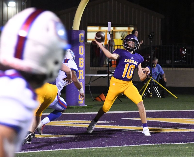 The Sentinel-Record/Grace Brown BOXED IN: Fountain Lake junior quarterback Ian Lacy attempts a pass Friday during the Cobras' 44-0 homecoming loss to Arkadelphia at Allen Tillery Field.