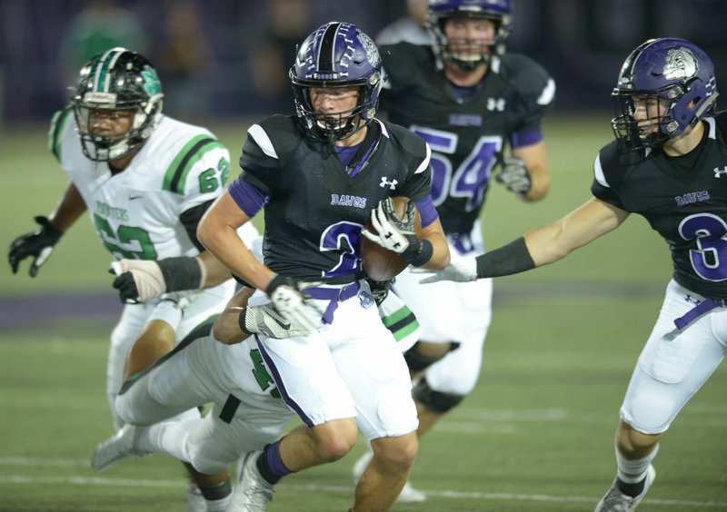 NWA Democrat-Gazette/ANDY SHUPE Fayetteville receiver Connor Flannigan (2) carries the ball as Van Buren defender Giovanni Alas attempts to make a tackle Friday, Oct. 5, 2018, during the first half at Harmon Stadium in Fayetteville. Visit nwadg.com/photos to see more photographs from the game.