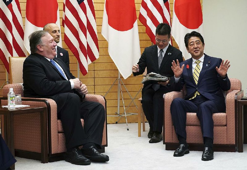 Secretary of State Mike Pompeo (left) and Japanese Prime Minister Shinzo Abe (right) meet Saturday in Abe’s office in Tokyo. Pompeo held talks with Japanese officials ahead of his trip to North Korea.