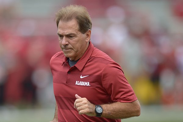 Alabama coach Nick Saban leaves the field Saturday, Oct. 6, 2018, during play against Arkansas at Razorback Stadium in Fayetteville. 