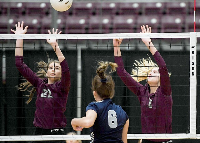 Charlie Kaijo/NWA Democrat-Gazette Siloam Springs blockers Rachel Conrad, left, and Ellie Lampton attempt to stuff the kill attempt of Greenwood's Abby Cagle during Thursday's 5A-West Conference match inside Panther Activity Center. Greenwood defeated Siloam Springs 3-0.