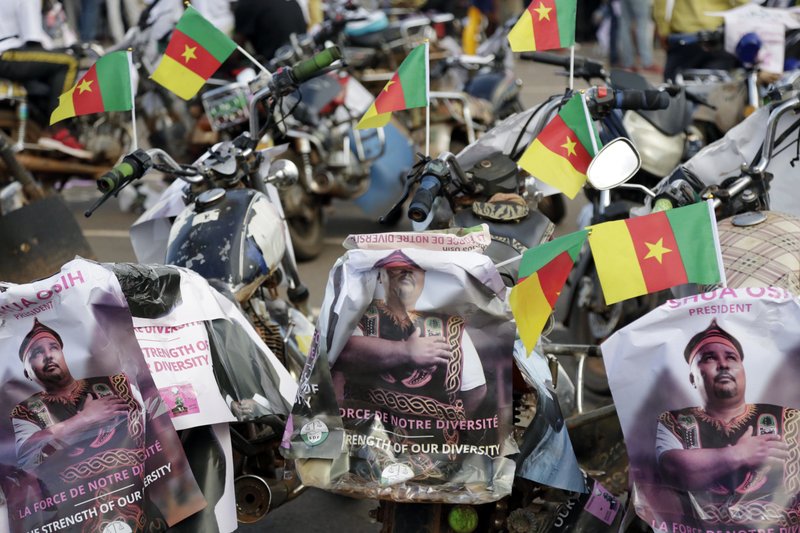 In this photo taken Friday, Oct. 5. 2018, motor taxis of supporters of Social Democratic Front opposition party presidential candidate Joshua Osih are parked during a rally in Yaounde, Cameroon. Africa's oldest leader is expected to win Sunday's election despite Anglophone separatists threatening to disrupt it. (AP Photo/Sunday Alamba)