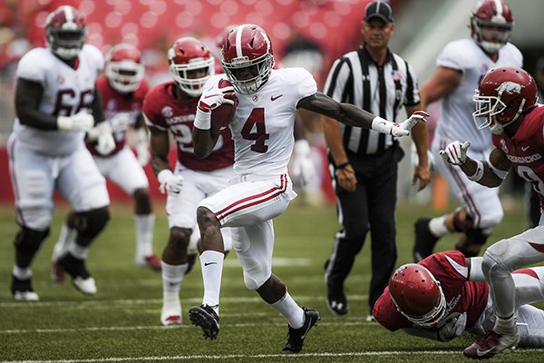 Alabama Crimson Tide wide receiver Jerry Jeudy (4) carries the ball for a score during the second quarter of a football game, Saturday, October 6, 2018 at Donald W. Reynolds Razorback Stadium in Fayetteville.