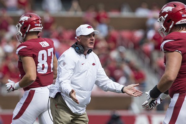 Arkansas coach Chad Morris greets players on the sideline during a game against Alabama on Saturday, Oct. 6, 2018, at Razorback Stadium in Fayetteville.