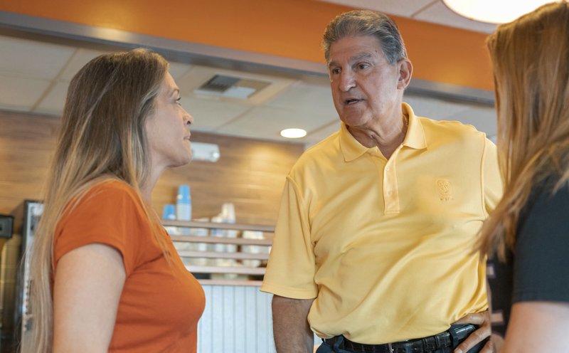 Democrat Senator Joe Manchin speaks about his recent vote in the Senate to confirm Brett Kavanaugh, Sunday, Oct. 7, 2018 at IHOP Charleston W.Va. A day after Manchin broke with his party on what may be the most consequential vote of the young Trump era, the West Virginia Democrat faces a political firestorm back home. (AP Photo/Tyler Evert)