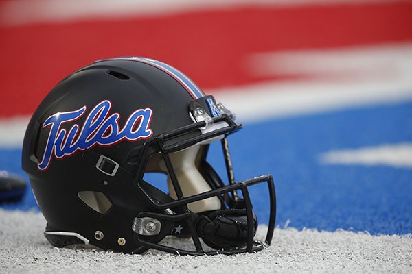 An Tulsa football helmet sits on the sideline before an NCAA football game against SMU, Saturday, Oct. 31, 2015, in Dallas. (AP Photo/Jim Cowsert)

