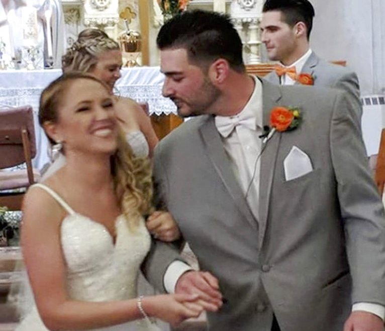 In this June 8, 2018 photo provided by Valerie Lynne Abeling, Erin and Shane McGowan attend their wedding reception in Amsterdam, N.Y. The couple were among the 20 people who died in Saturday's limousine crash in Schoharie, N.Y. "You're always hoping you find the love of your life, it's what you hope and wish and dream for, and they found each other," Erin McGowan's uncle Anthony Vertucci said. "They had big plans." (Valerie Lynne Abeling via AP)