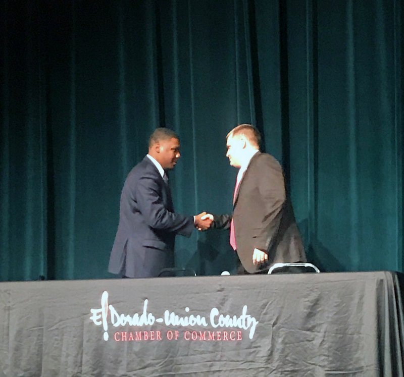 Candidates for Union County coroner Martavious Carrigan, a Democrat, left, and Stormey Primm, Republican, right, shake hands before the Union County NAACP Chapter and the El Dorado-Union County Chamber of Commerce public forum Tuesday at the El Dorado Municipal Auditorium.