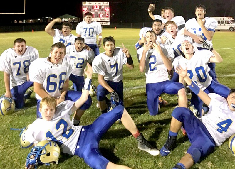 Westside Eagle Observer/SUBMITTED The Decatur Bulldog football team celebrates its first victory in nearly two years after defeating the Hermitage Hermits in a road game Oct. 5.