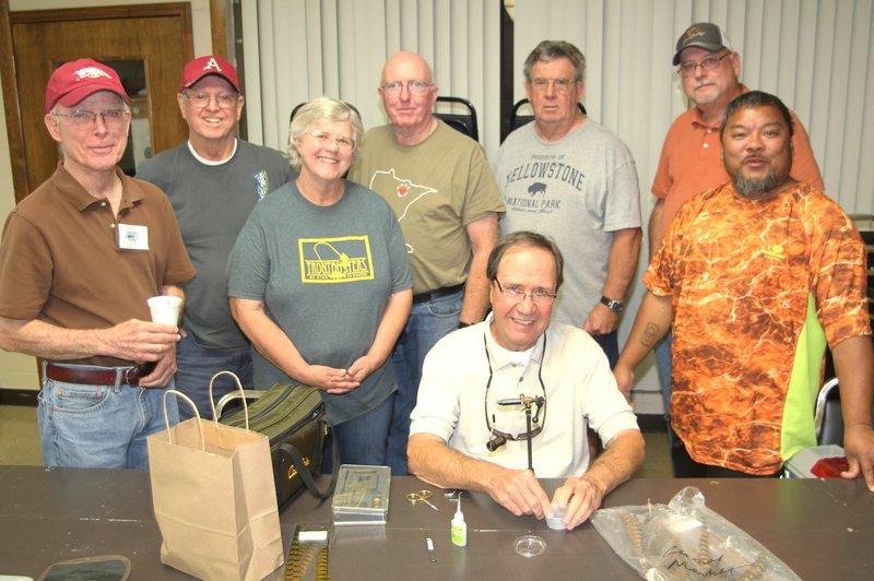 Photo submitted Pictured are a few of the members of the advanced fly-tyers class: Richard Starr (left), Marvin Macedo, Beth Armour, Steve Curtis, Jim Hudson, Gary Henderson and Mike Mullenix. The advanced class is taught by club member Dave Barfield (seated).