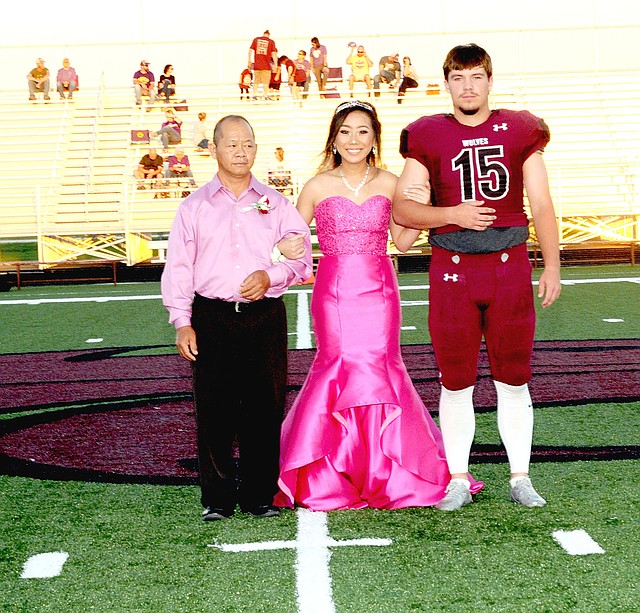Photo courtesy of LifeTouch National Studios/Lincoln senior maid, Gao Lee, daughter of Ning-ma Lee and Neng fang Lee, escorted by her father and senior, Caleb Lloyd, son of Jerry and Angie Lloyd.